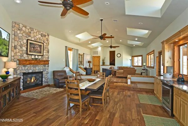 a living room with fireplace furniture and a fireplace