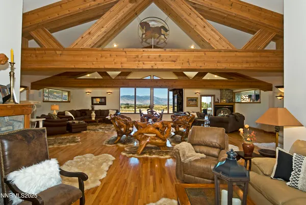 a view of a patio with table and chairs