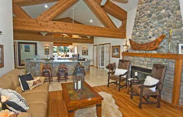 a living room with lots of furniture and a fireplace