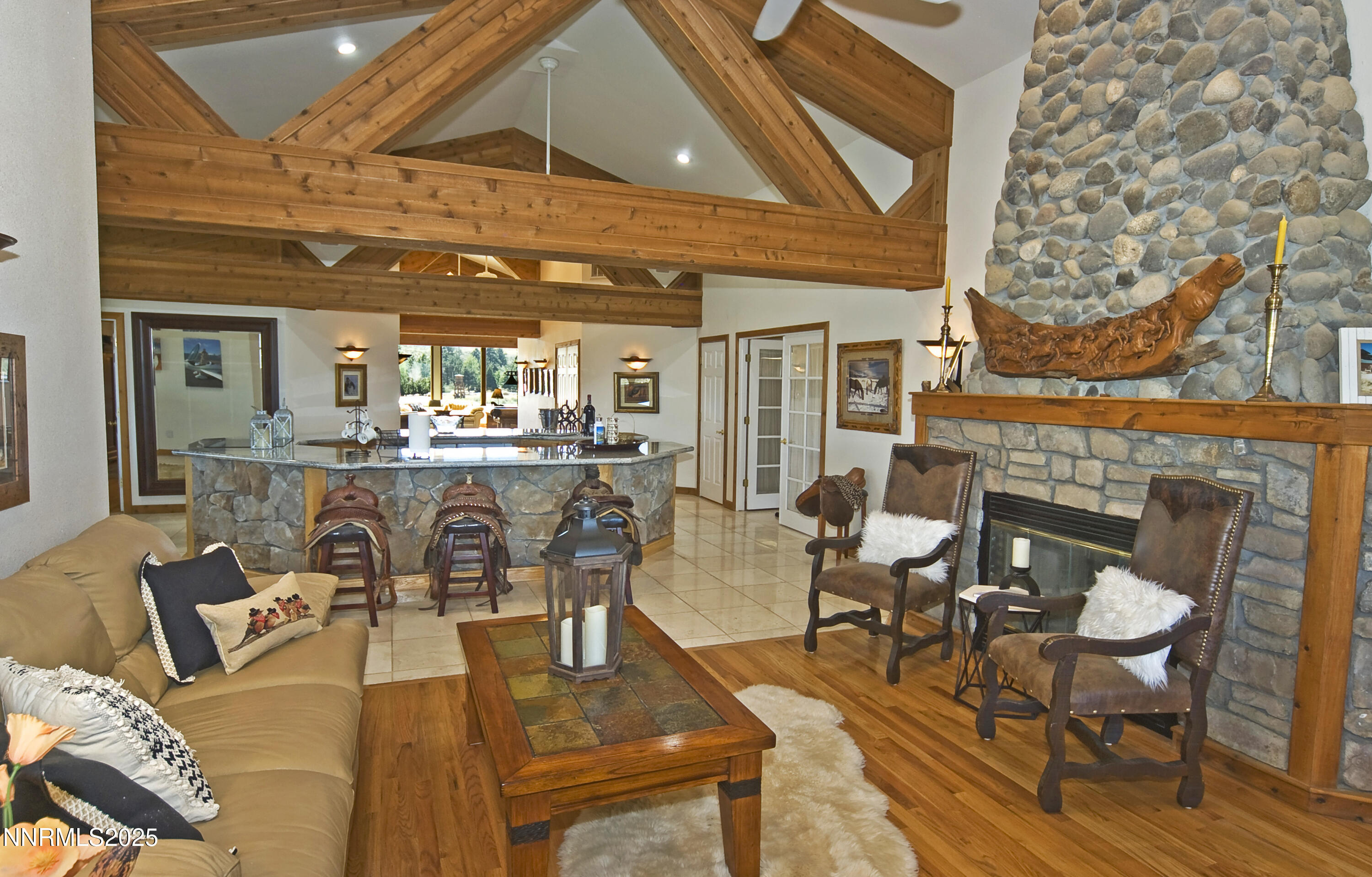 827 River Ranch Road Markleeville, CA 96120 - Photo 30 of 46 a living room with lots of furniture and a fireplace