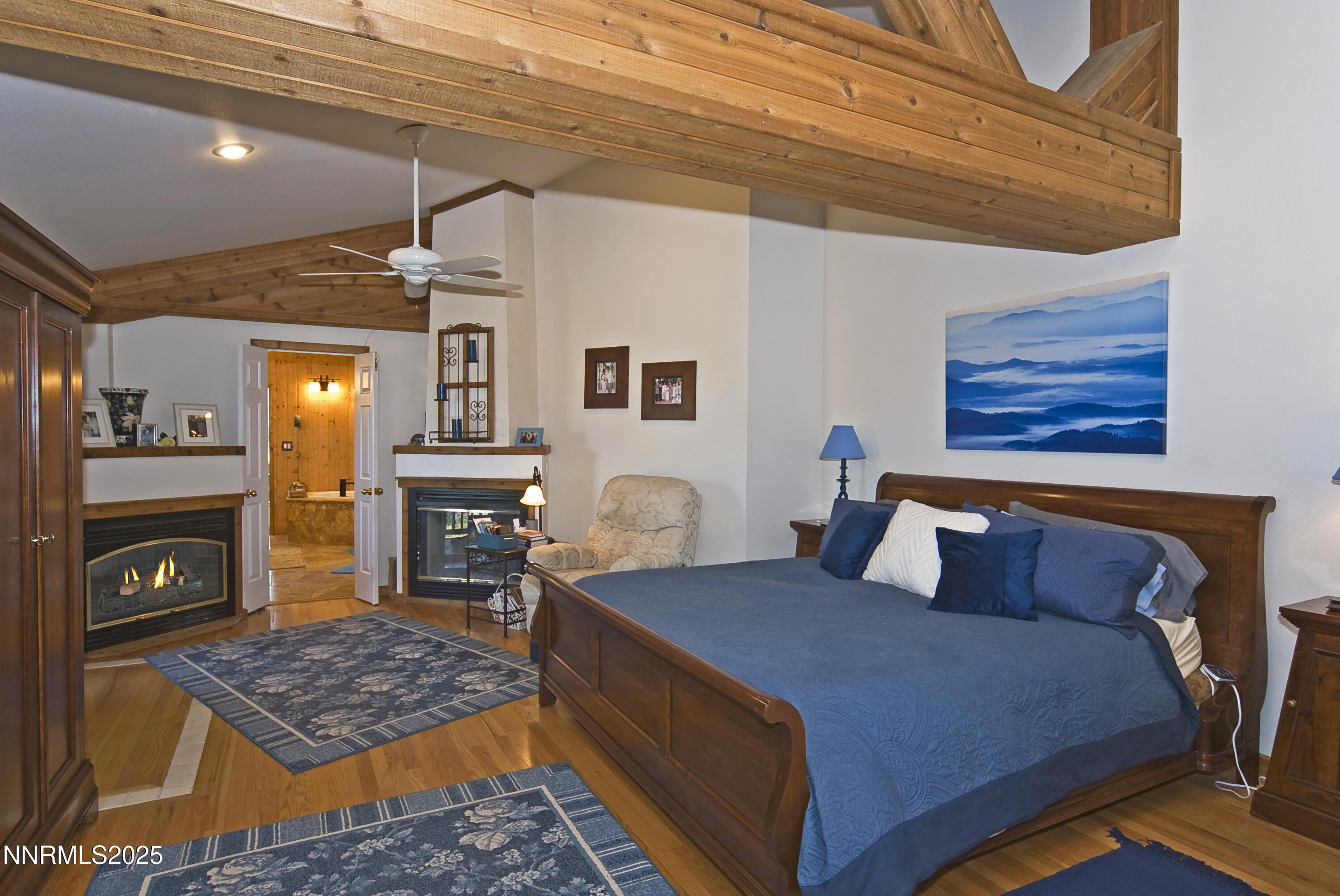 827 River Ranch Road Markleeville, CA 96120 - Photo 33 of 46 a bedroom with a bed and wooden floor