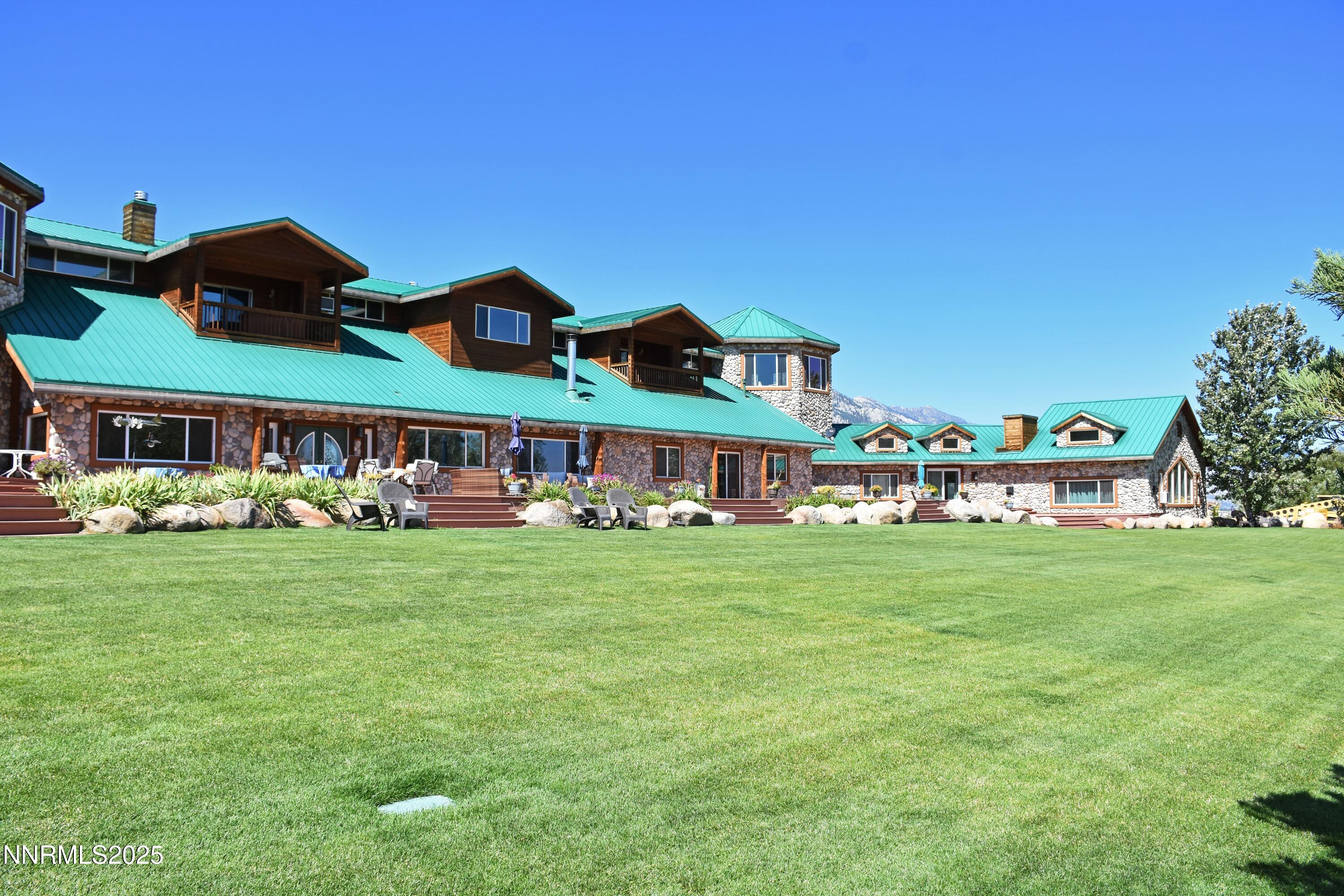 827 River Ranch Road Markleeville, CA 96120 - Photo 44 of 46 a front view of a house with garden