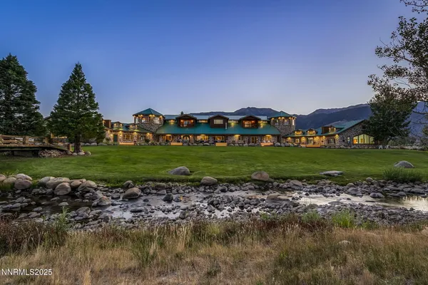 a view of a garden with a building in the background