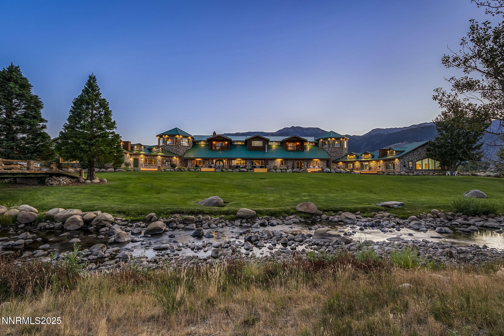 827 River Ranch Road Markleeville, CA 96120 - Photo 5 of 46 a view of a garden with a building in the background
