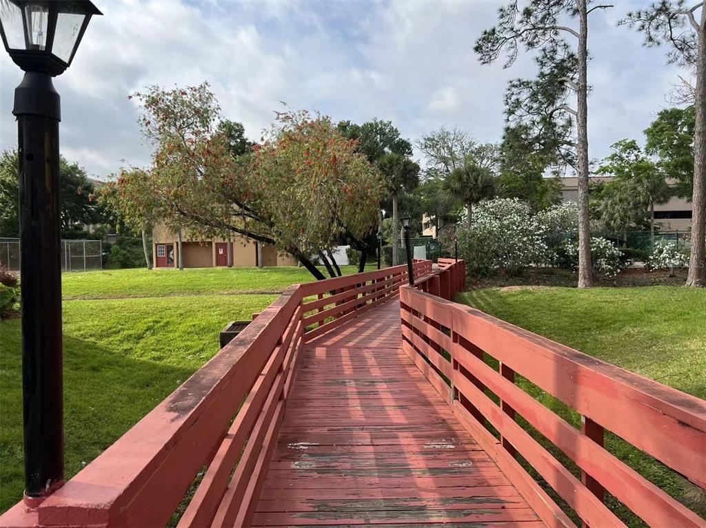 5812 Windhover Drive, Unit 5812 Orlando, FL 32819 - Photo 25 of 27 a view of an outdoor space and a backyard