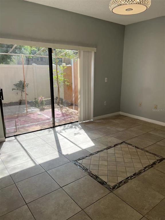 5812 Windhover Drive, Unit 5812 Orlando, FL 32819 - Photo 7 of 27 a view of a room with a porch