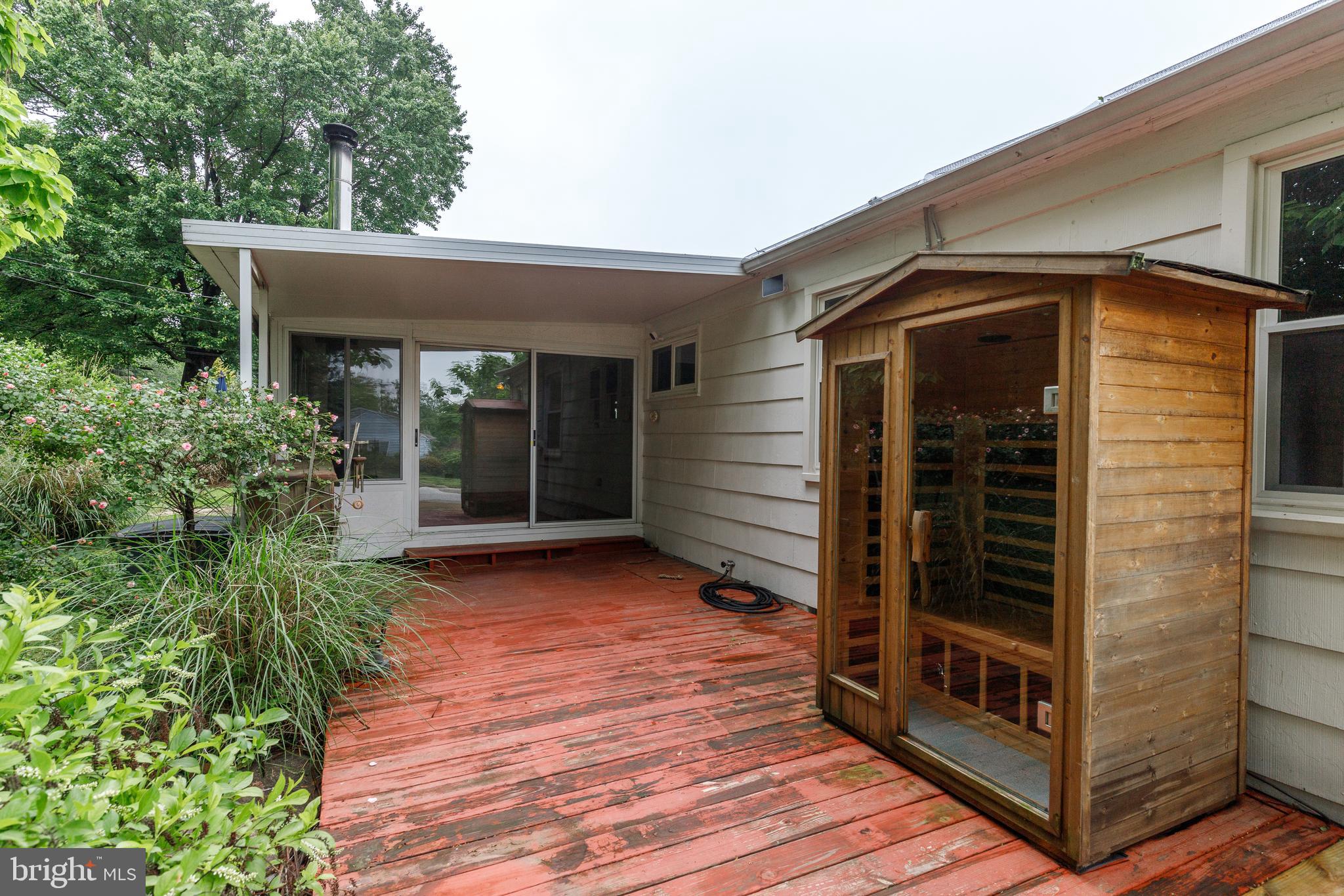 7500 Rocksham Drive Towson, MD 21286 - Photo 21 of 26 a view of backyard with small cabin and wooden floor