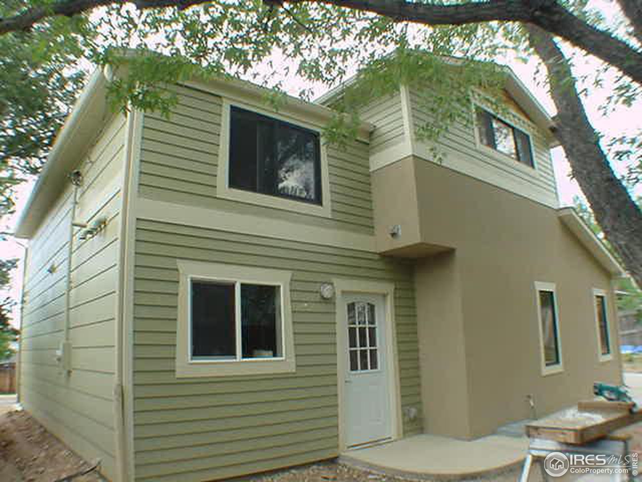 1395 Georgetown Road Boulder, CO 80305 - Photo 3 of 16 a view of a house with a tree