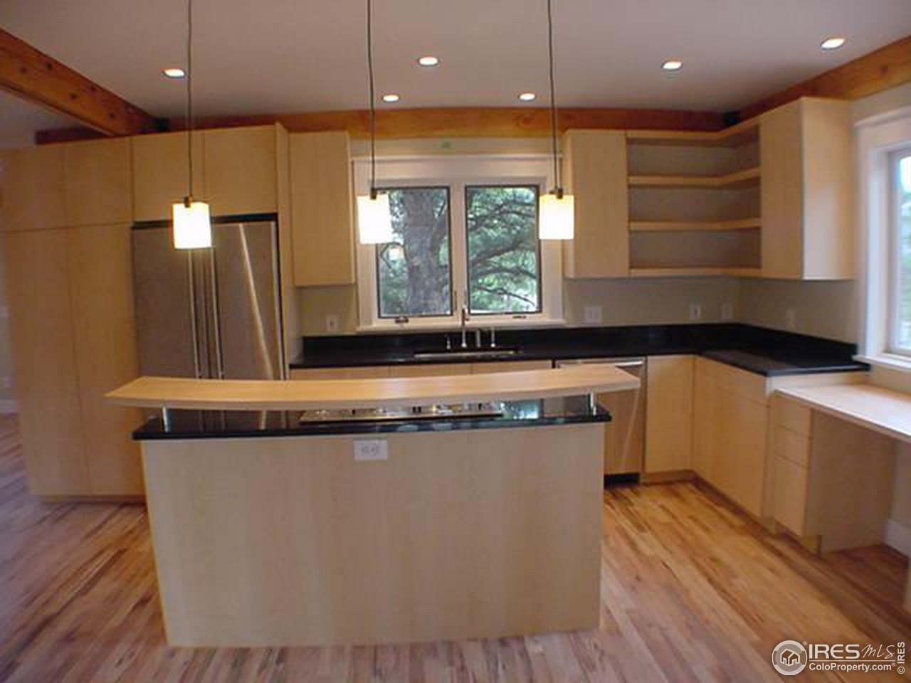 1395 Georgetown Road Boulder, CO 80305 - Photo 7 of 16 a view of a kitchen counter space a sink a window and stainless steel appliances