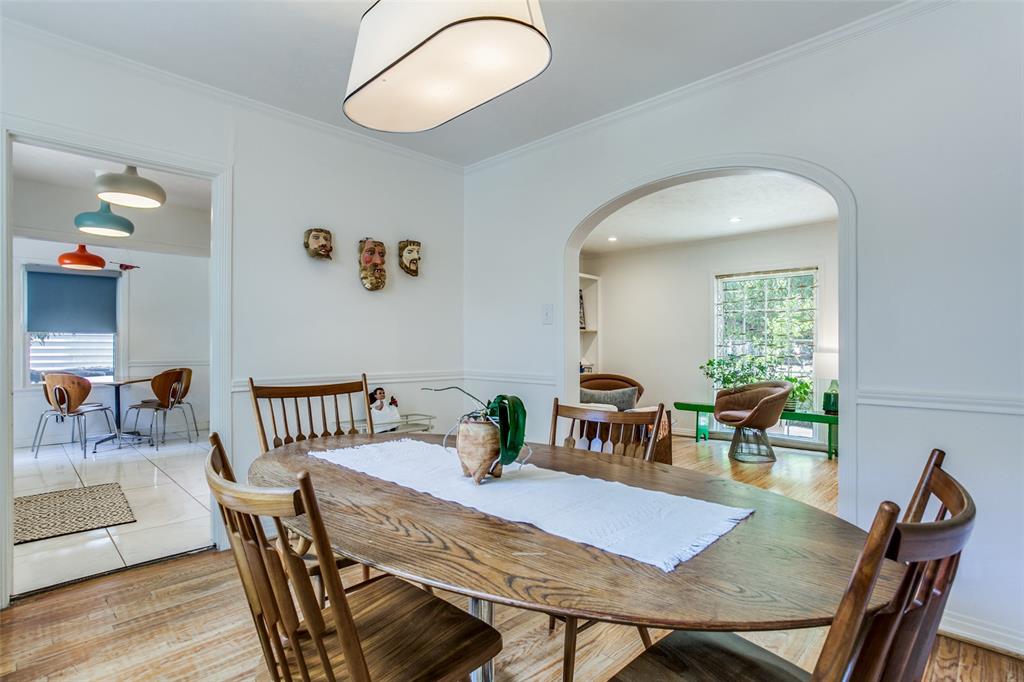 8619 Angora Street Dallas, TX 75218 - Photo 9 of 24 Dining space featuring light hardwood / wood-style flooring and ornamental molding
