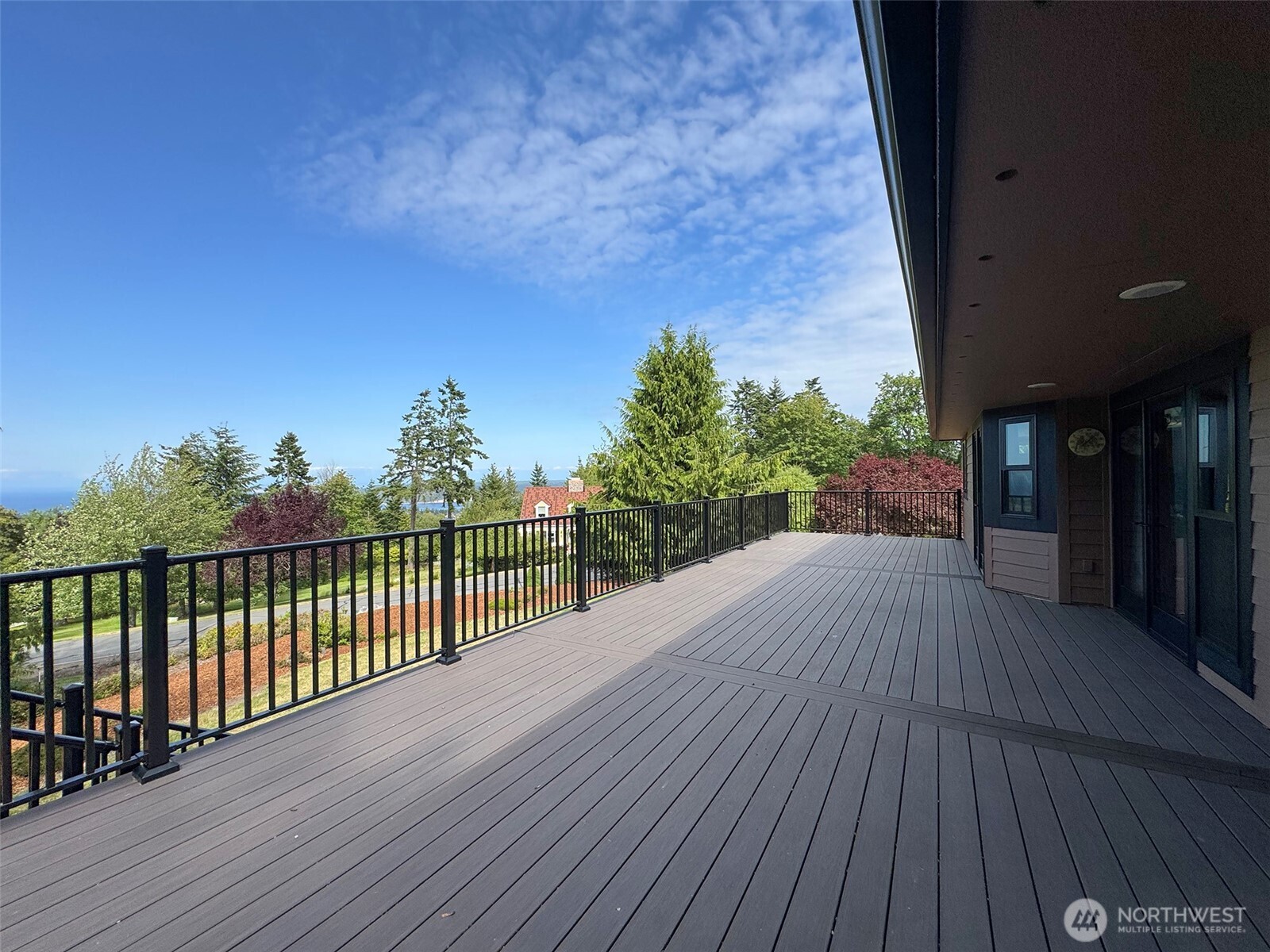 412 Doe Run Road Sequim, WA 98382 - Photo 16 of 40 a view of a balcony with wooden floor