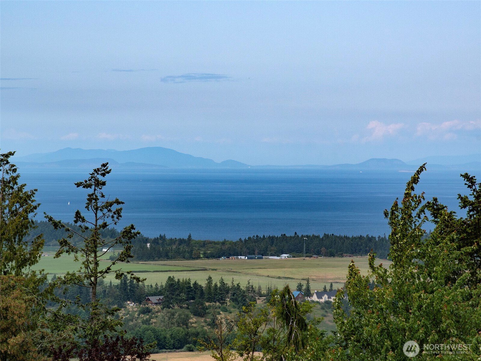412 Doe Run Road Sequim, WA 98382 - Photo 2 of 40 a view of a lake with a city