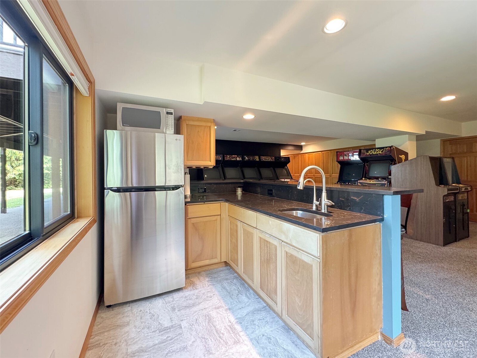 412 Doe Run Road Sequim, WA 98382 - Photo 31 of 40 a kitchen with stainless steel appliances granite countertop a refrigerator a sink and a stove
