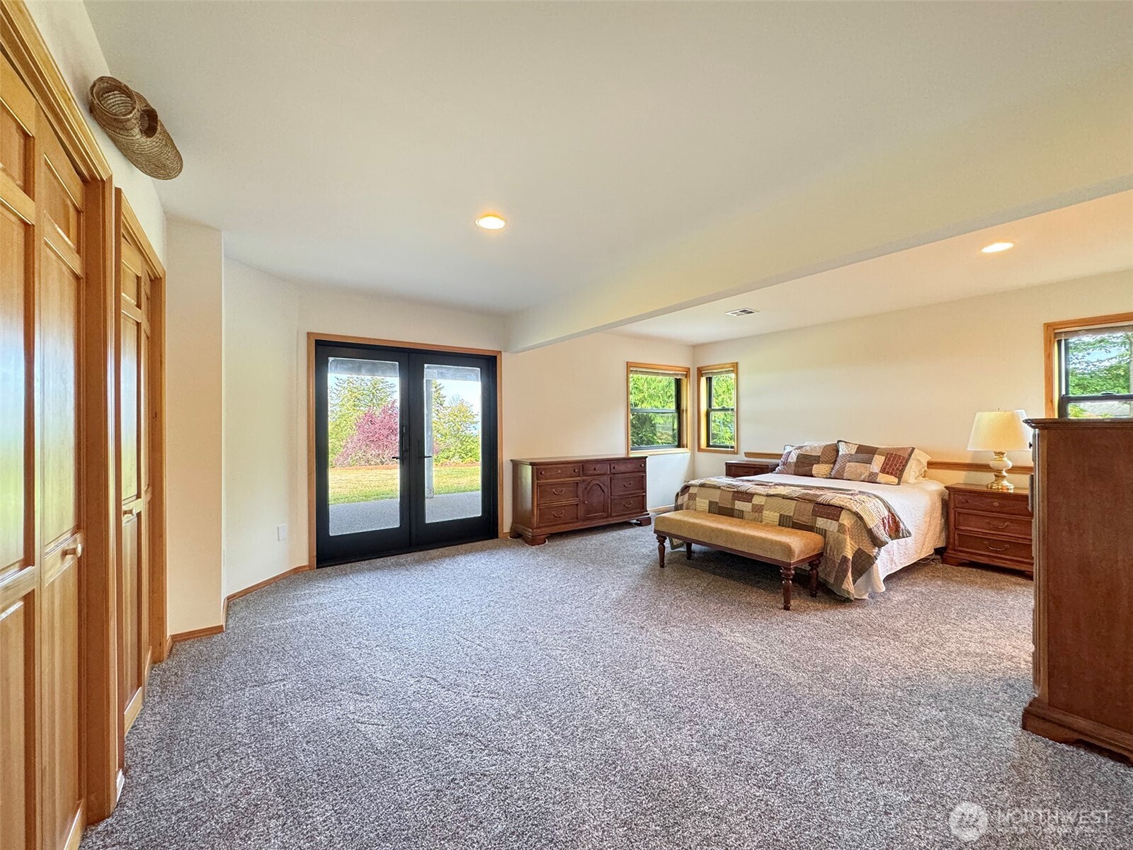 412 Doe Run Road Sequim, WA 98382 - Photo 36 of 40 a spacious bedroom with a bed and a window
