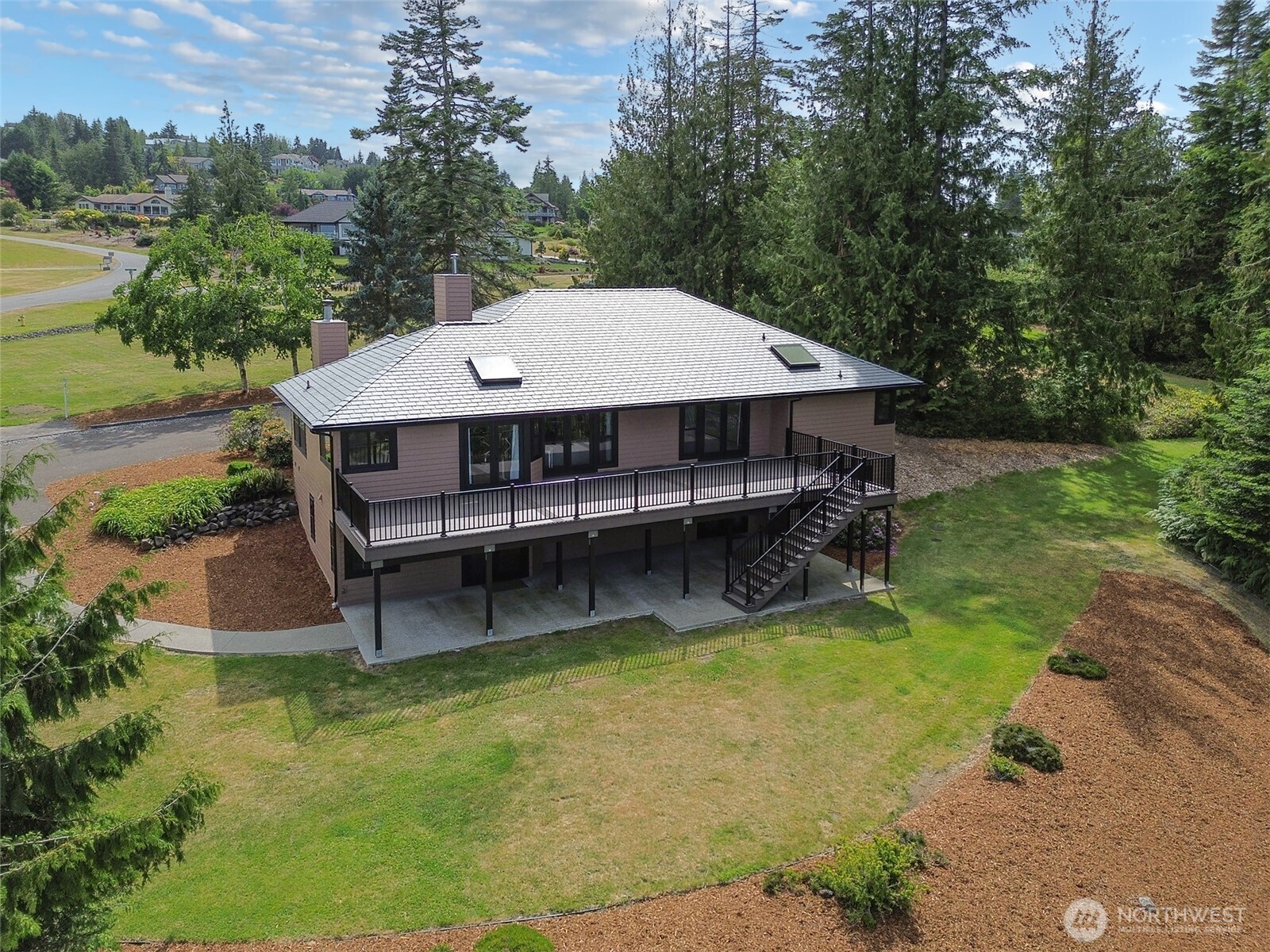 412 Doe Run Road Sequim, WA 98382 - Photo 4 of 40 an aerial view of a house with swimming pool and a yard