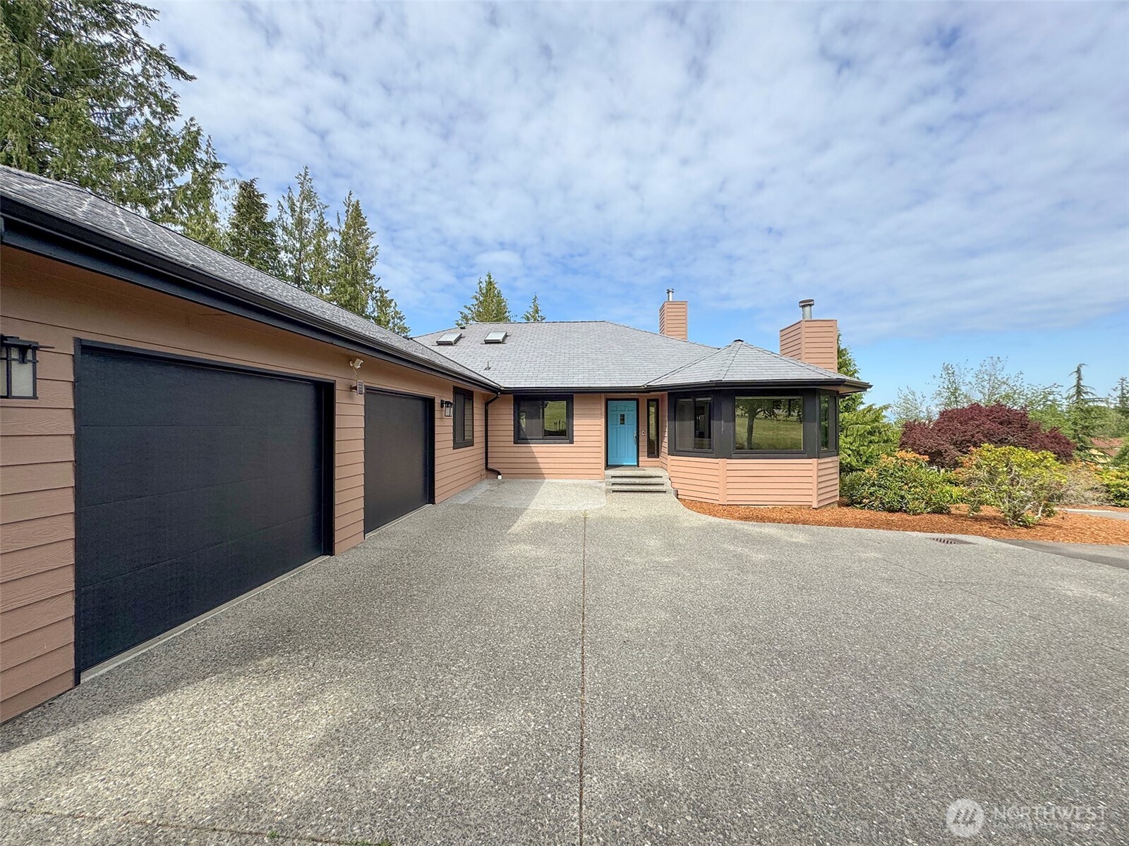 412 Doe Run Road Sequim, WA 98382 - Photo 5 of 40 a front view of a house with a yard