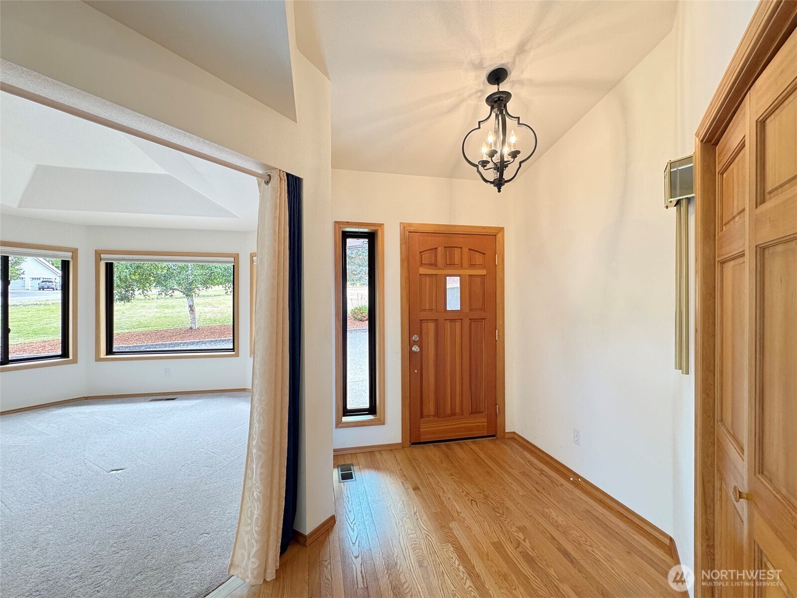 412 Doe Run Road Sequim, WA 98382 - Photo 7 of 40 a view of a room with wooden floor and windows