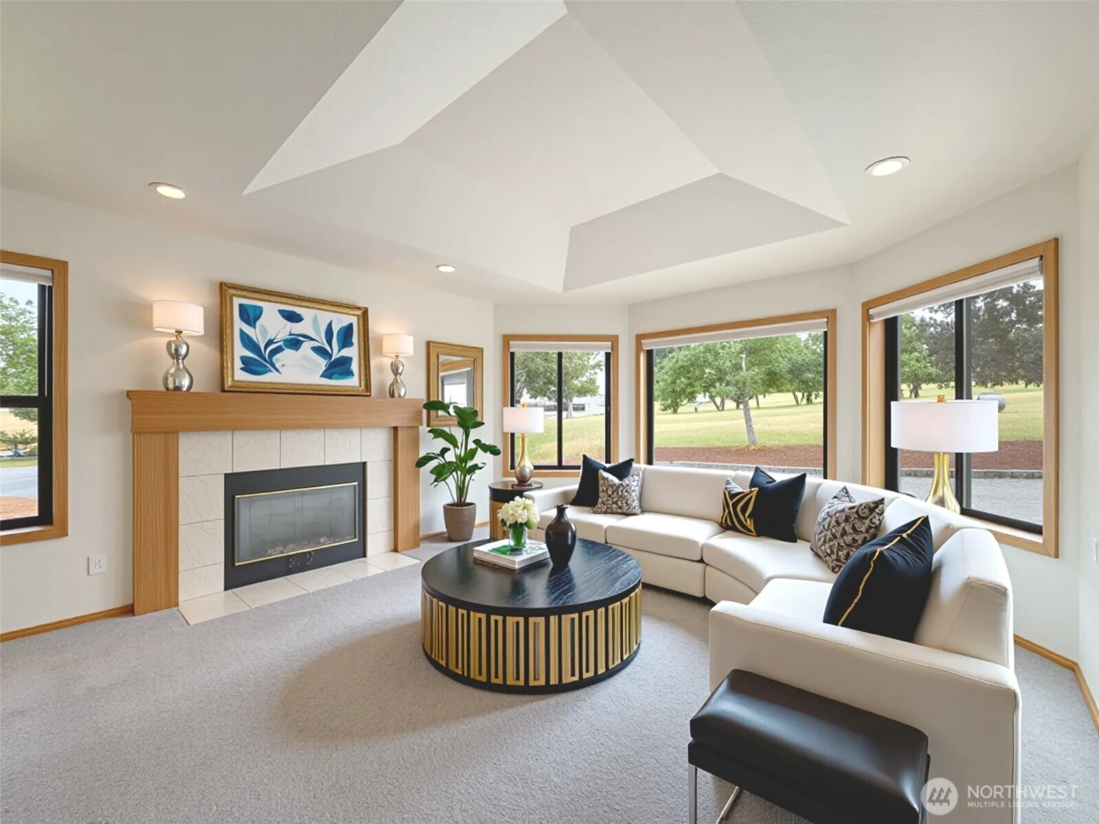 412 Doe Run Road Sequim, WA 98382 - Photo 8 of 40 a living room with furniture and a fireplace