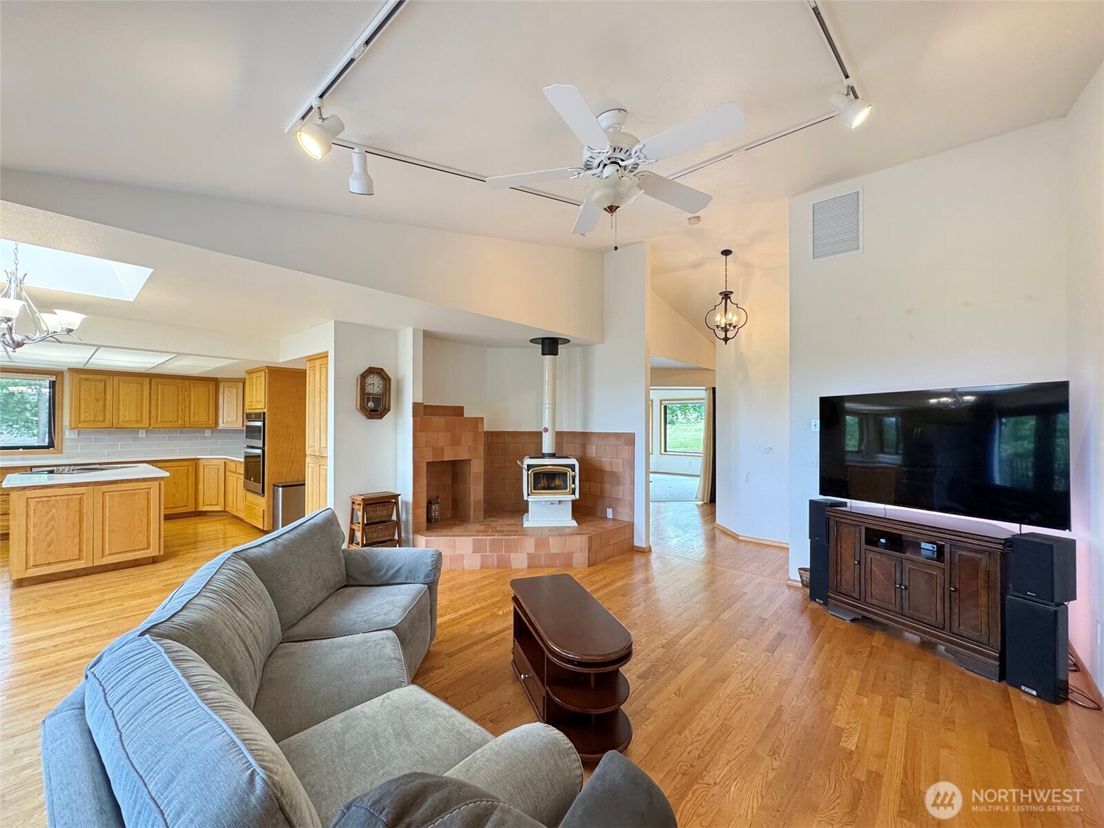 412 Doe Run Road Sequim, WA 98382 - Photo 10 of 40 a living room with furniture and a flat screen tv