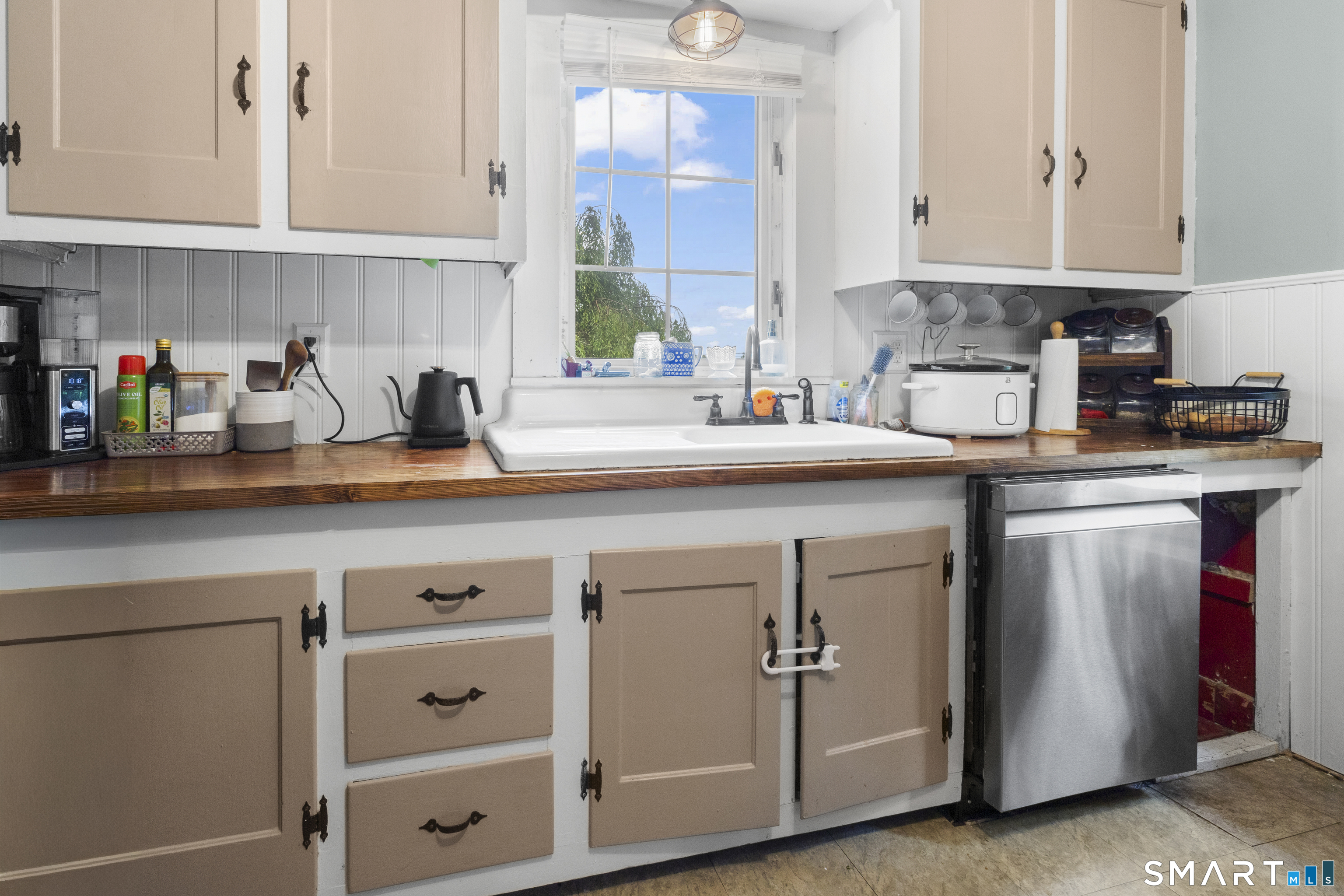 47 Broad Street Killingly, CT 06239 - Photo 11 of 33 a kitchen with cabinets appliances a sink and a counter space