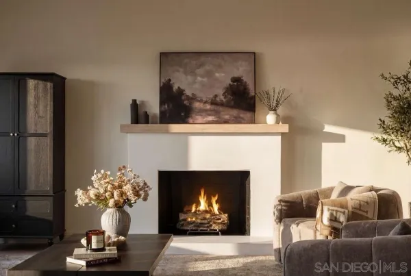 a living room with furniture and large windows
