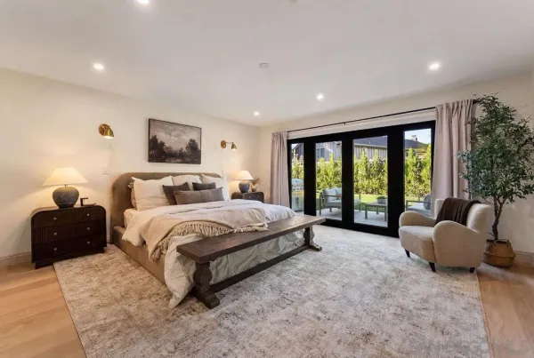 a bedroom with a bed and a couch