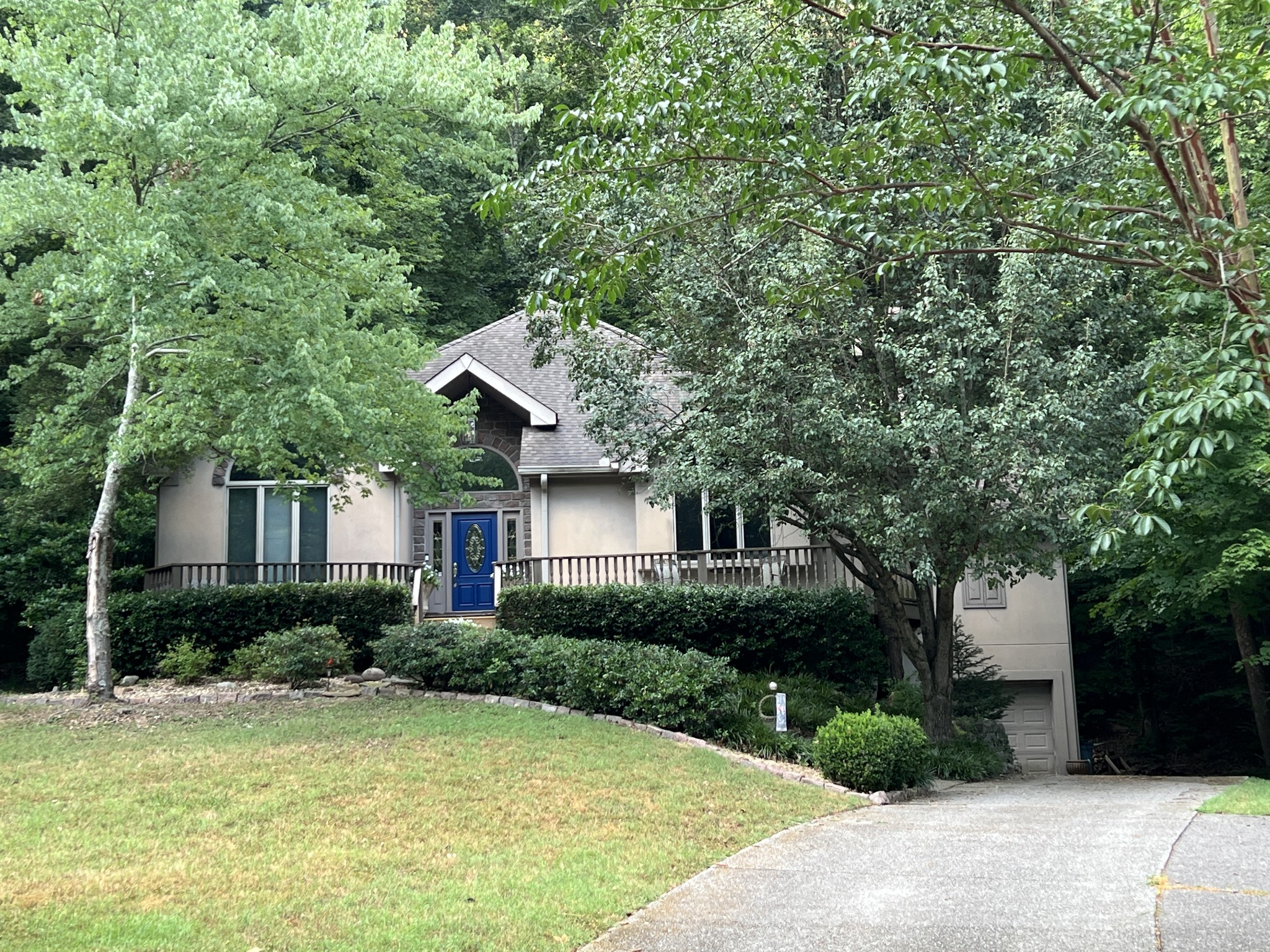 a front view of a house with garden