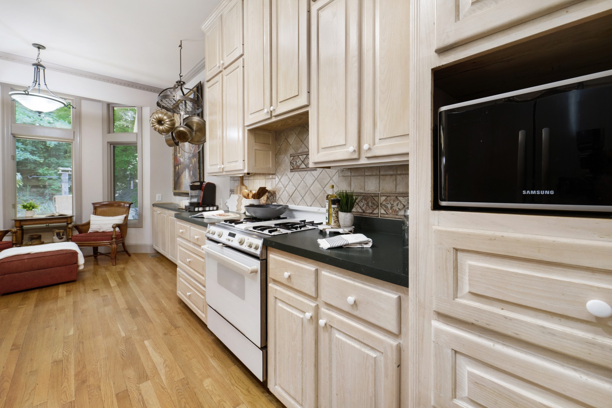 166 Hicks Road Nashville, TN 37221 - Photo 17 of 43 a kitchen with stainless steel appliances granite countertop a stove and a refrigerator