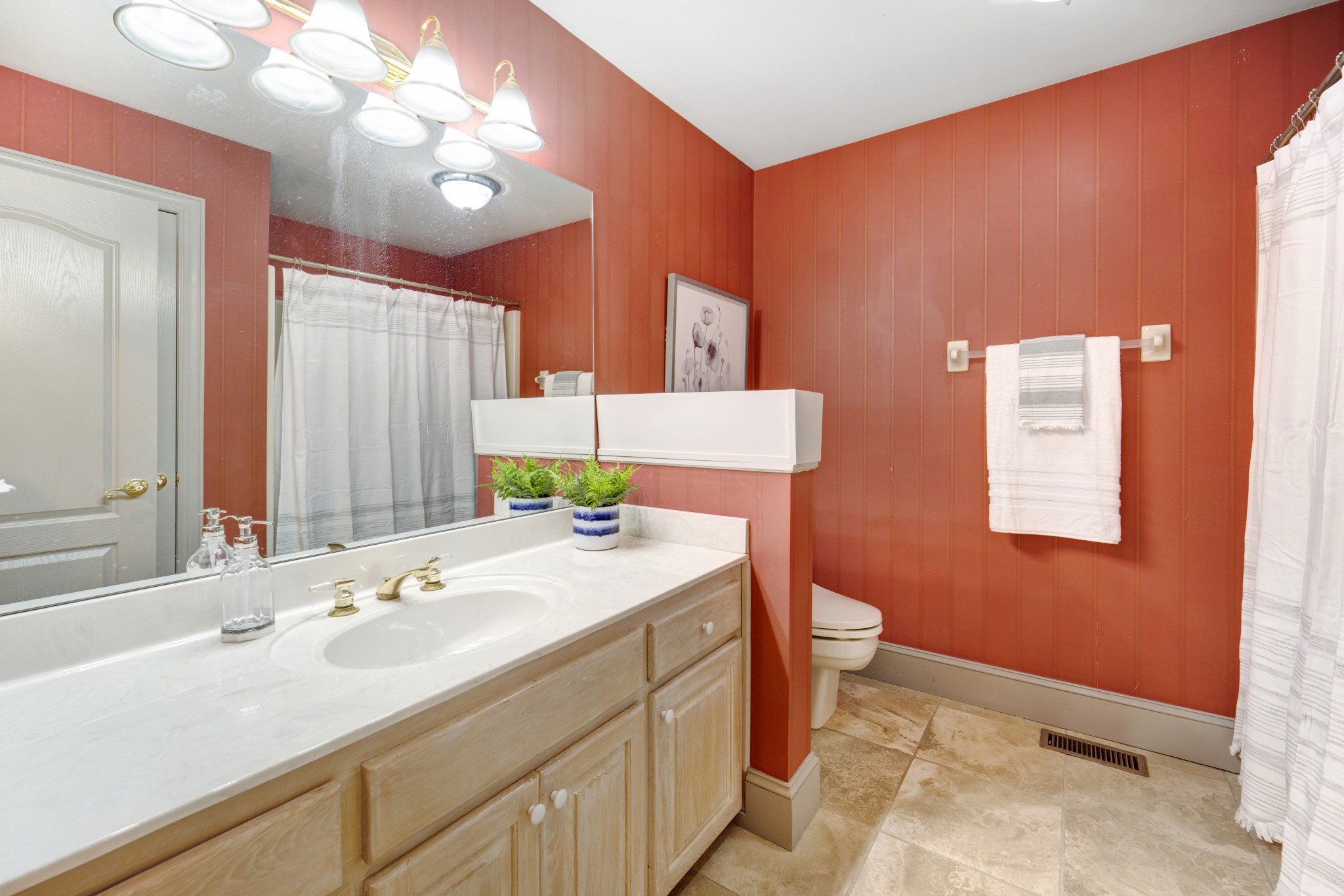 166 Hicks Road Nashville, TN 37221 - Photo 10 of 43 a bathroom with a granite countertop sink a toilet and a large mirror
