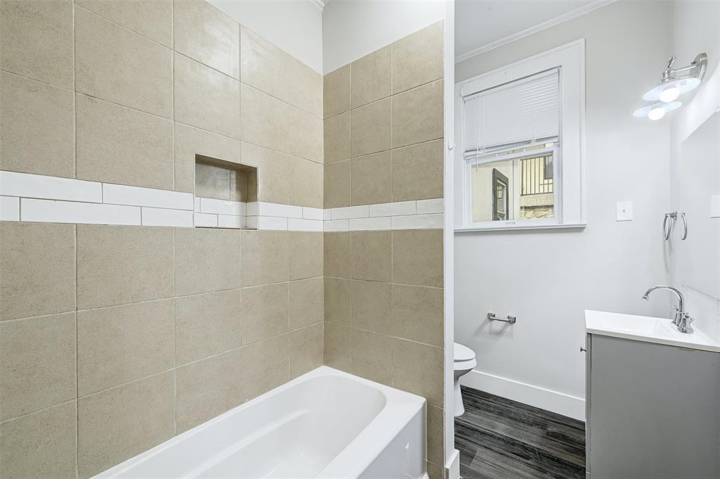 2511 San Gabriel Street Austin, TX 78705 - Photo 12 of 25 a bathroom with a bathtub and sink