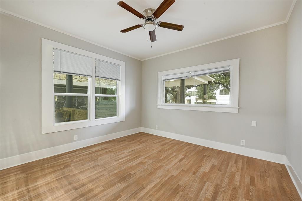 2511 San Gabriel Street Austin, TX 78705 - Photo 13 of 25 a view of an empty room with a window and wooden floor
