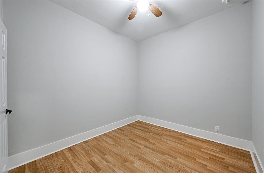 2511 San Gabriel Street Austin, TX 78705 - Photo 15 of 25 a view of an empty room with wooden floor and windows