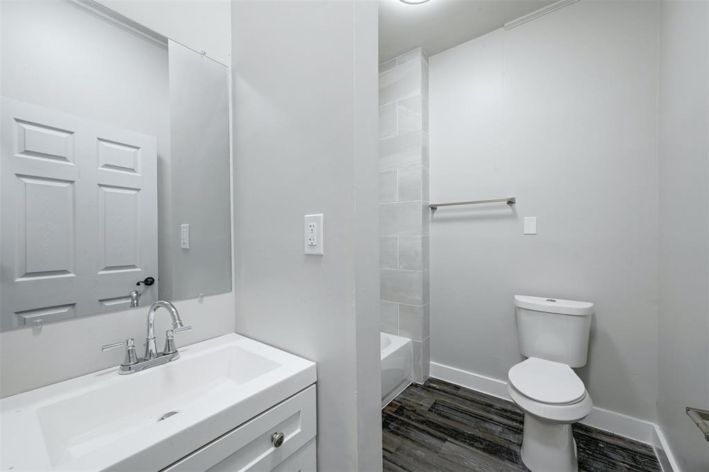 2511 San Gabriel Street Austin, TX 78705 - Photo 16 of 25 a bathroom with a toilet sink and mirror