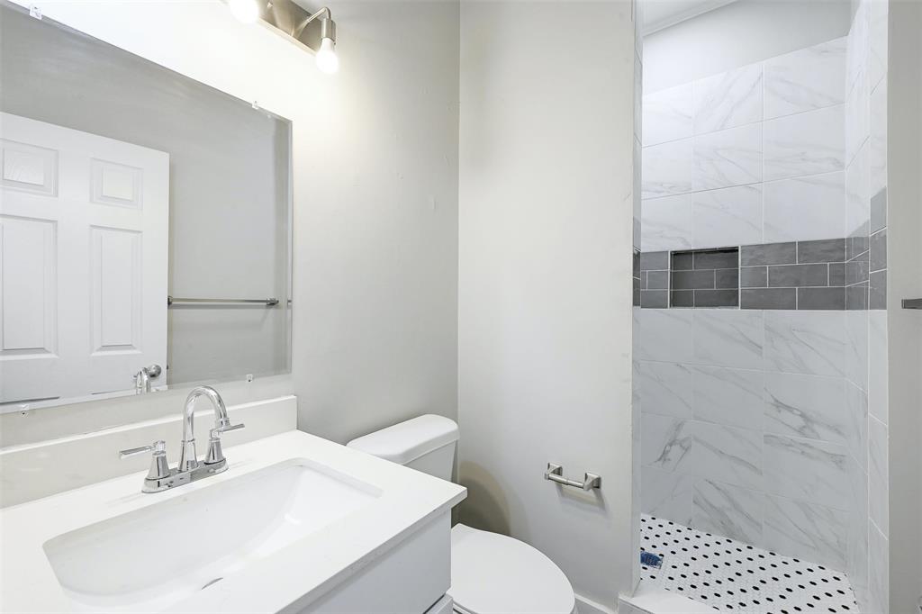 2511 San Gabriel Street Austin, TX 78705 - Photo 17 of 25 a bathroom with a sink toilet and shower