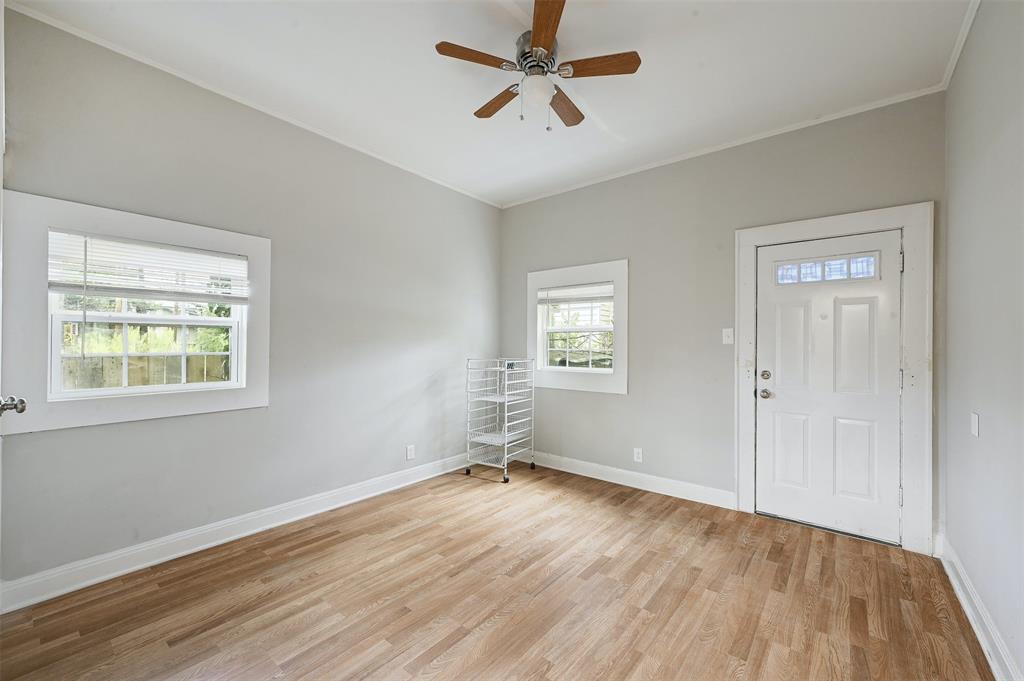 2511 San Gabriel Street Austin, TX 78705 - Photo 18 of 25 a view of empty room with wooden floor and fan