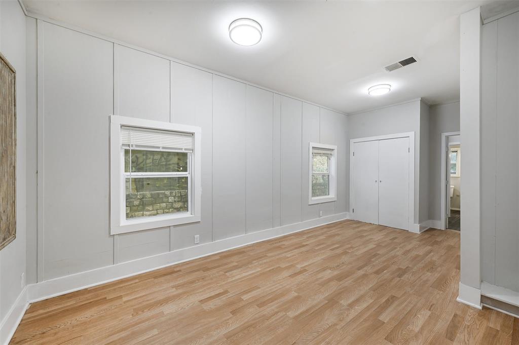 2511 San Gabriel Street Austin, TX 78705 - Photo 20 of 25 a view of an empty room with wooden floor and a window