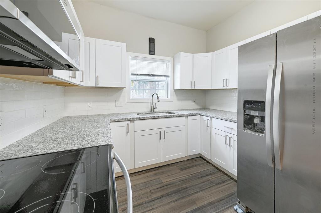 2511 San Gabriel Street Austin, TX 78705 - Photo 5 of 25 a kitchen with cabinets and stainless steel appliances