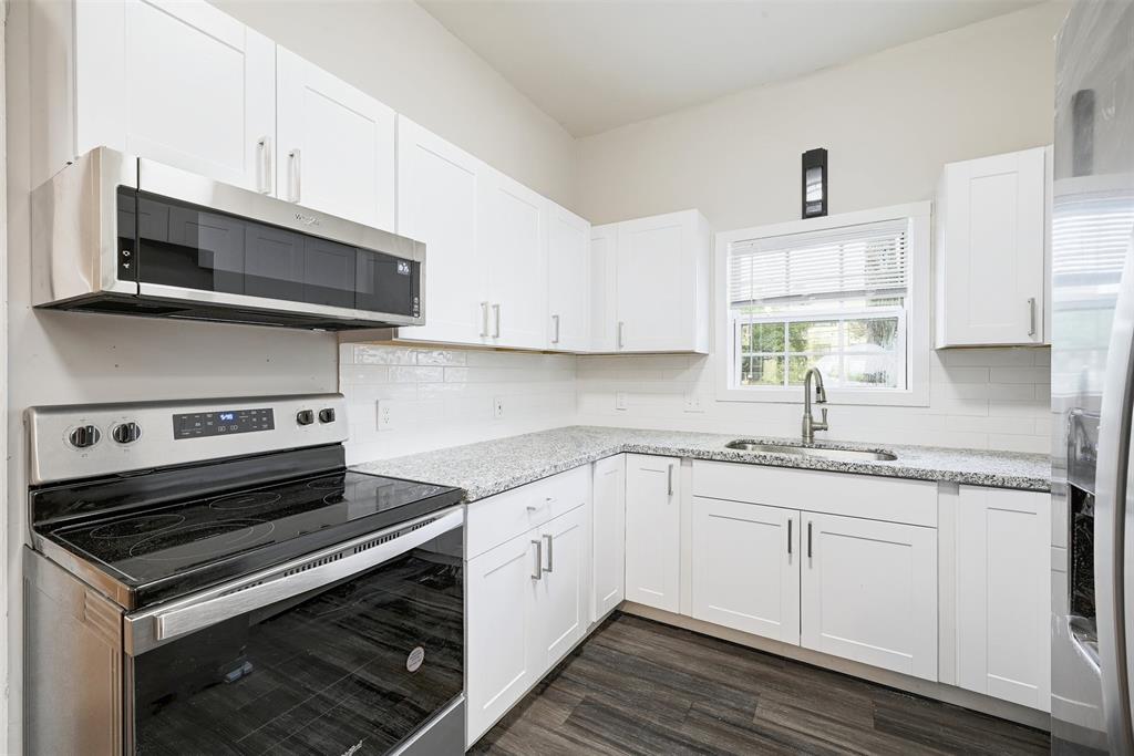 2511 San Gabriel Street Austin, TX 78705 - Photo 8 of 25 a kitchen with a stove microwave and sink