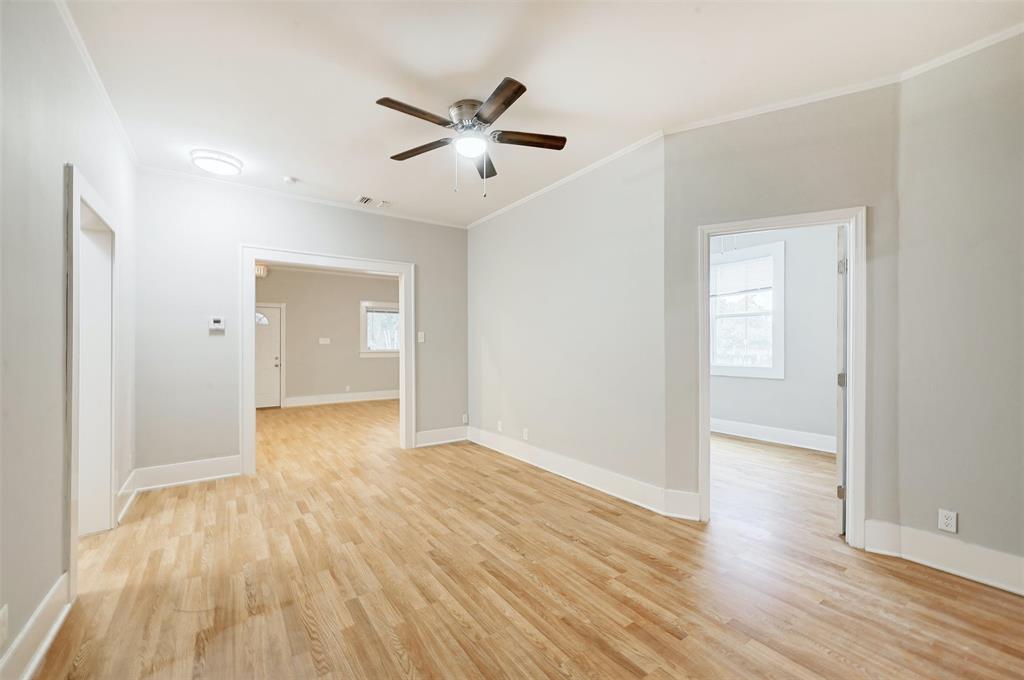2511 San Gabriel Street Austin, TX 78705 - Photo 10 of 25 an empty room with wooden floor and natural light