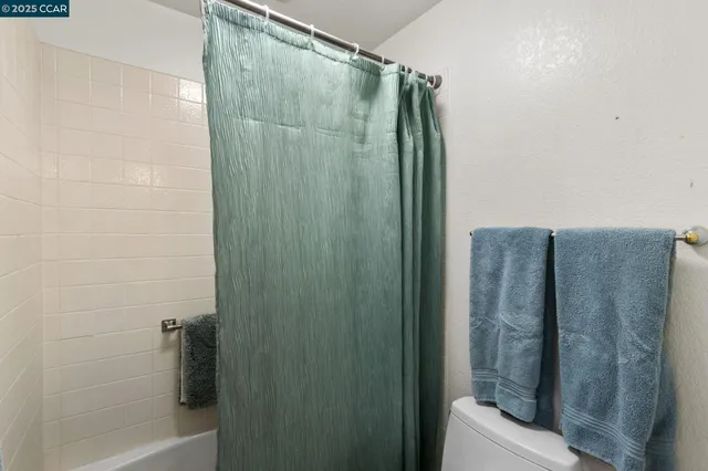 a bathroom with a shower and a tub