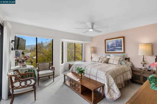 a bedroom with a bed and a couch