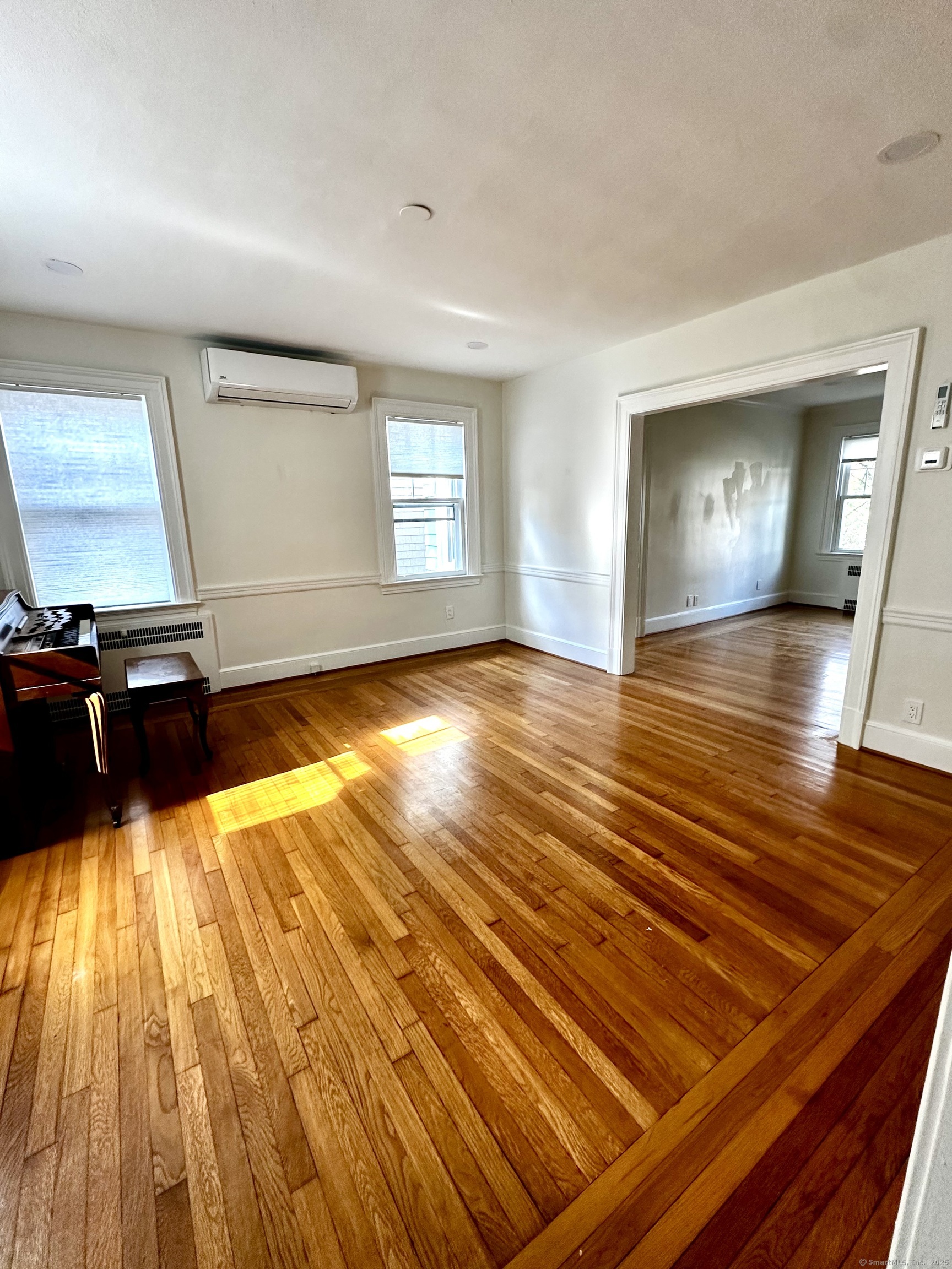 65 Spring Garden Street Hamden, CT 06517 - Photo 11 of 19 a view of a room with wooden floor and staircase
