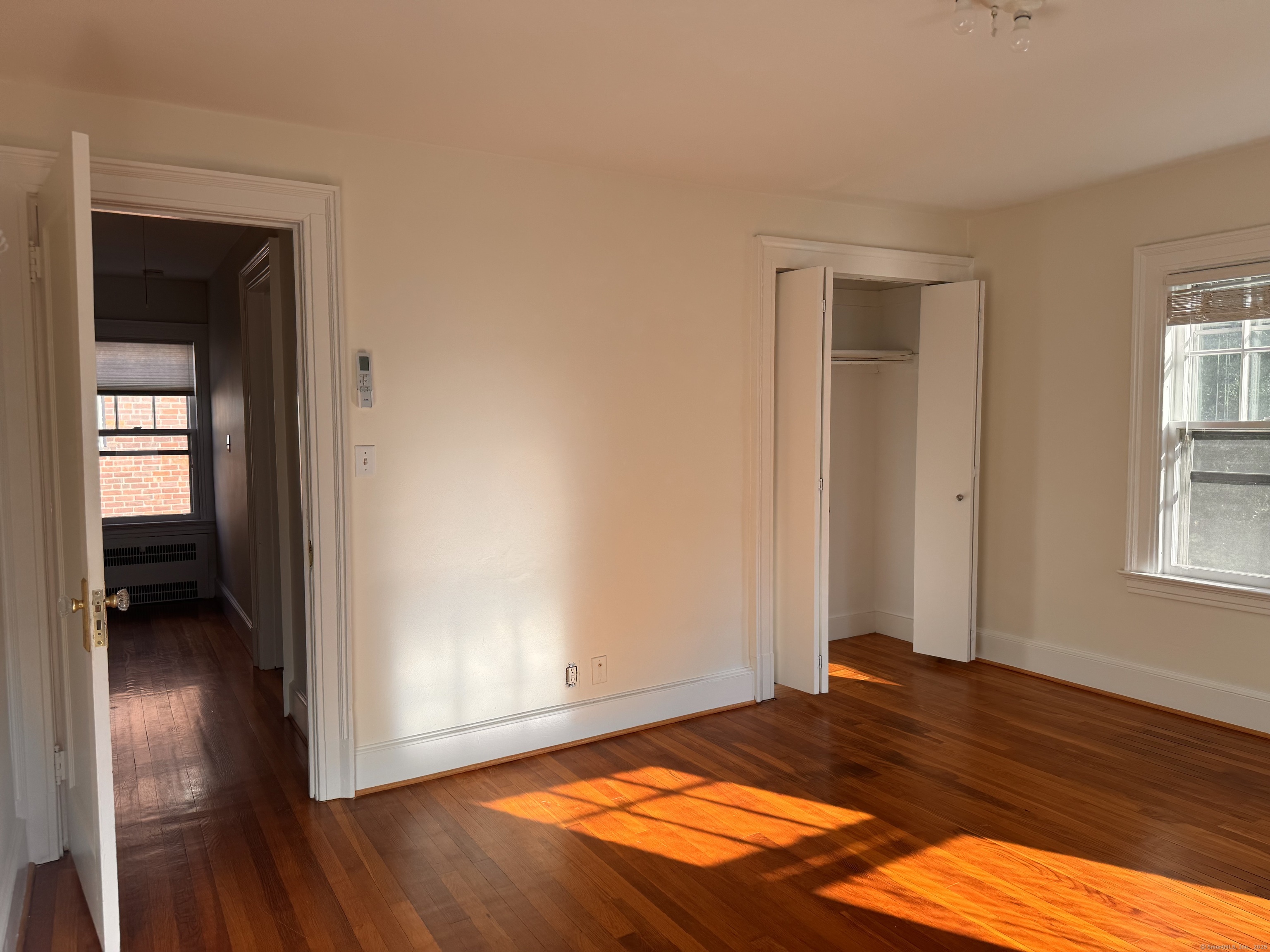 65 Spring Garden Street Hamden, CT 06517 - Photo 16 of 19 a bedroom with a bed and a window