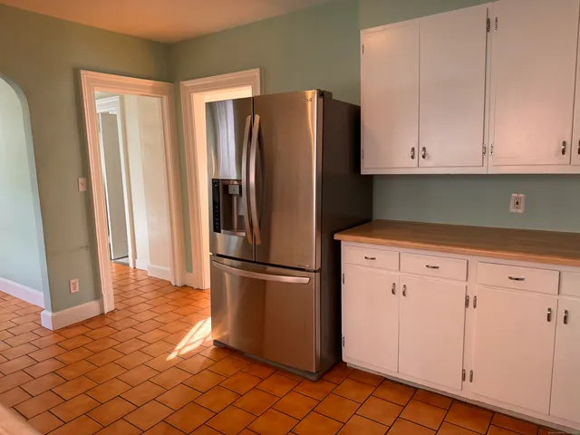 a kitchen with cabinets and stainless steel appliances