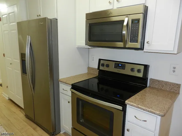 a kitchen with a stove and a microwave