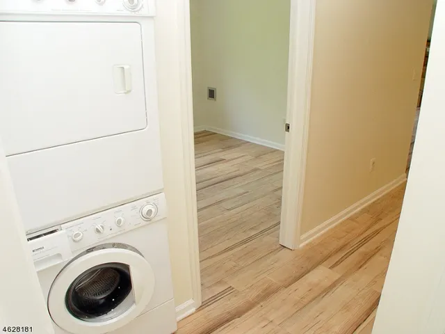 a view of a hallway with washer and dryer