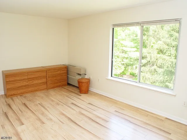 a view of a room with a bed