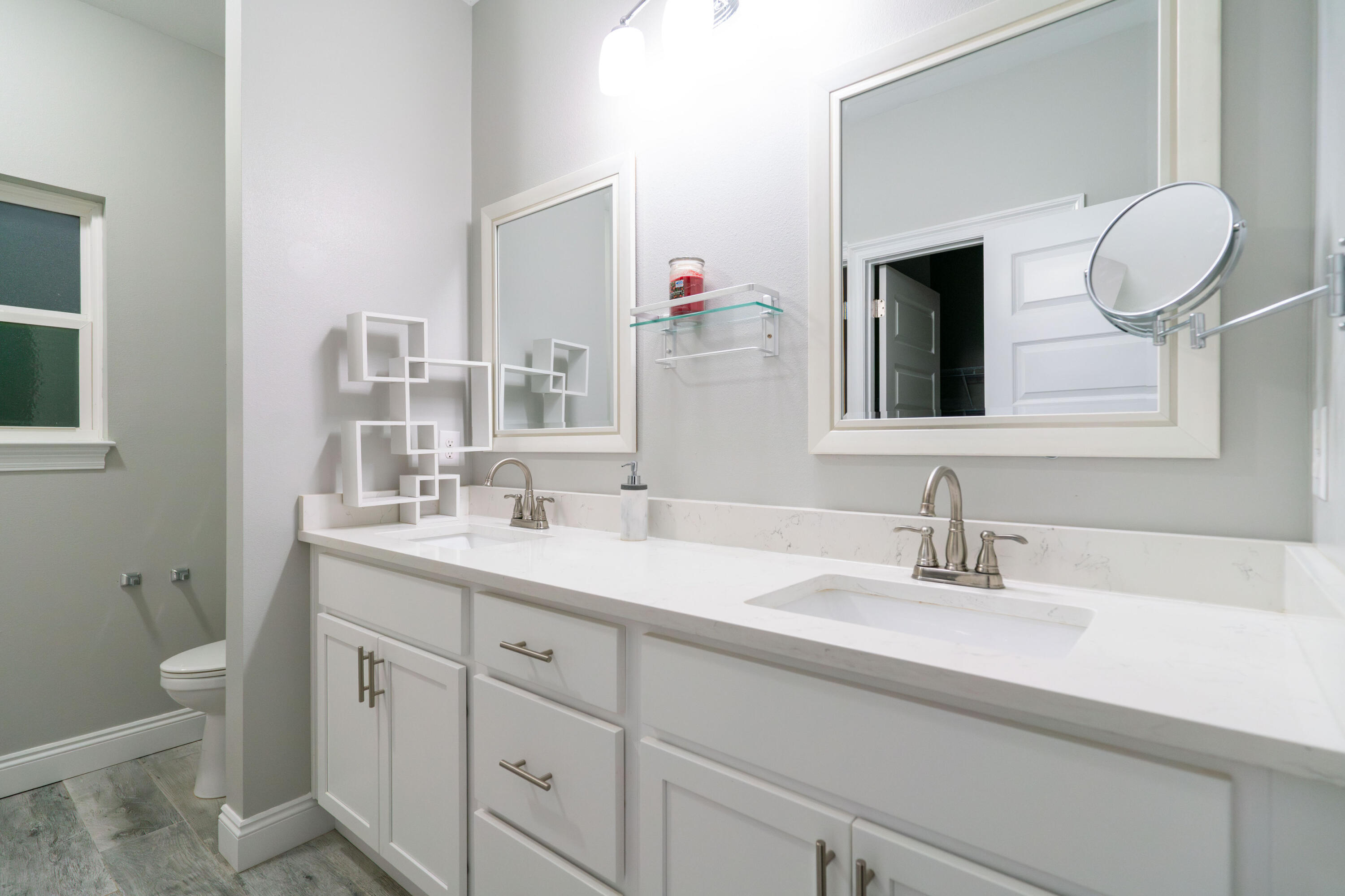 2243 Wind Trace Road North Navarre, FL 32566 - Photo 15 of 34 a bathroom with a granite countertop sink and a mirror