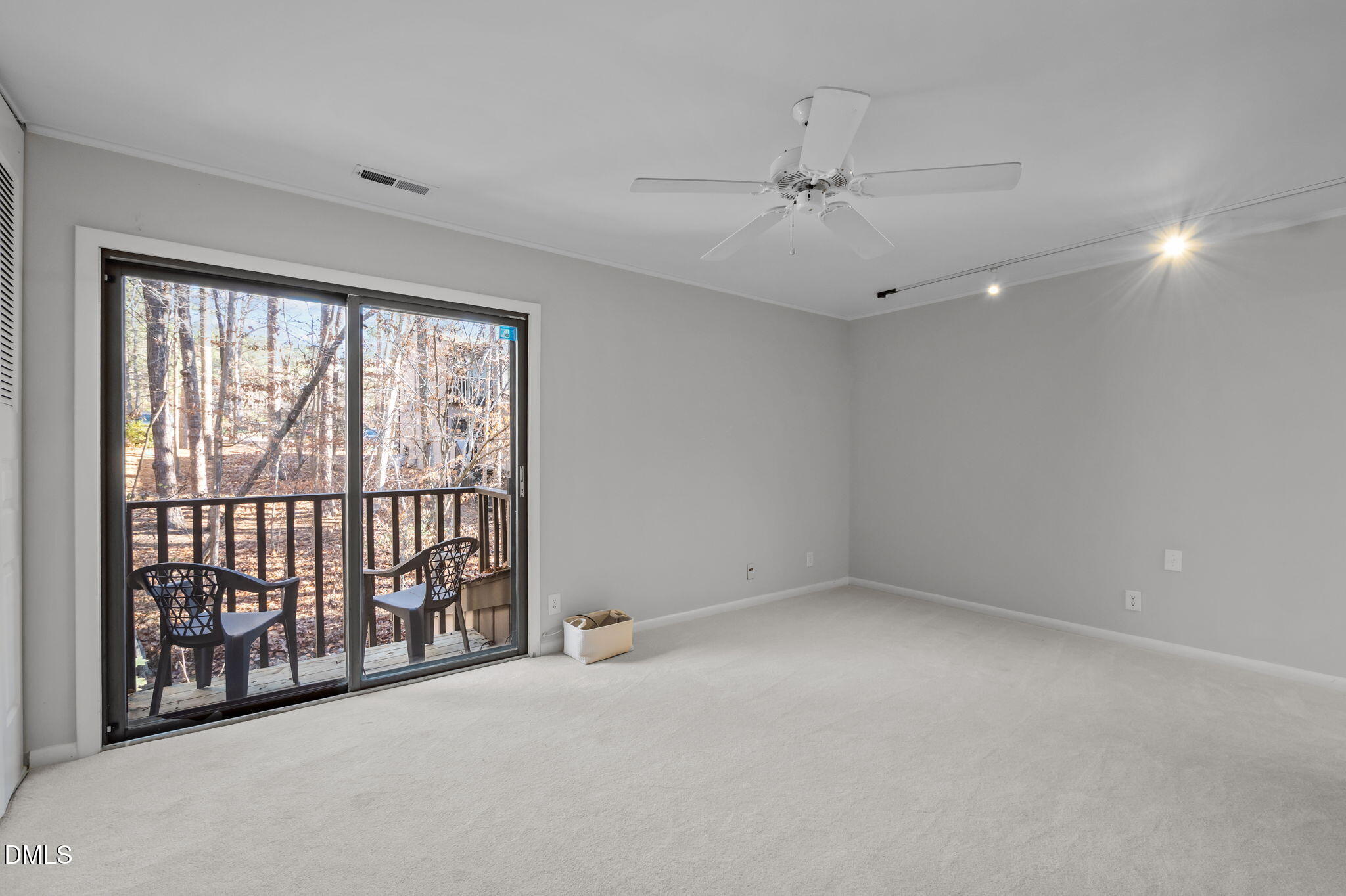 3080 Colony Road, Unit 3080C Durham, NC 27705 - Photo 19 of 57 an empty room with windows and ceiling fan