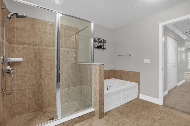 a bathroom that has a glass shower door
